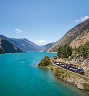 Train passing by a lake