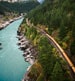 Canadian Rockies train passing by a river